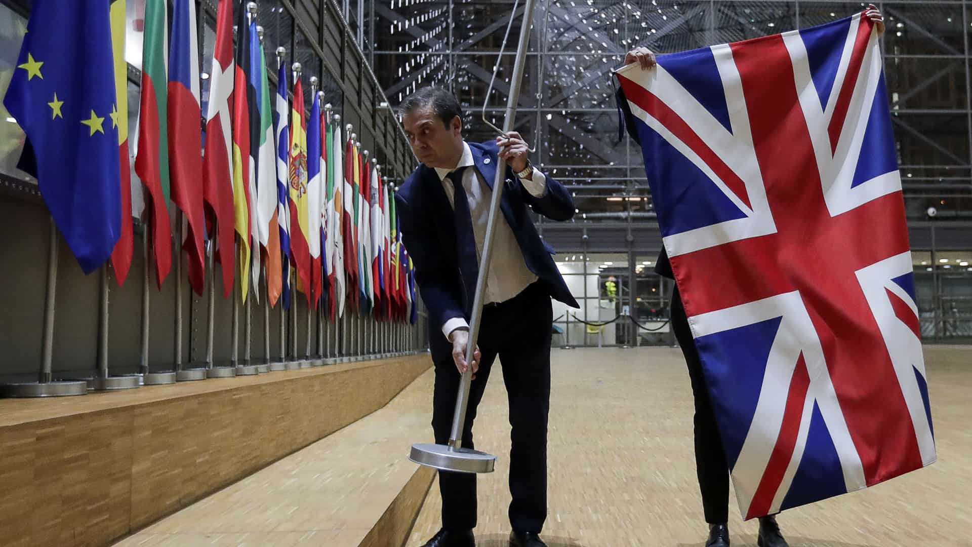 The UK flag being removed from the EU Council building in Brussels AFP Photo