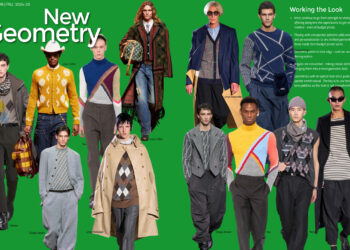 The cover of a fashion magazine with men walking down the street.